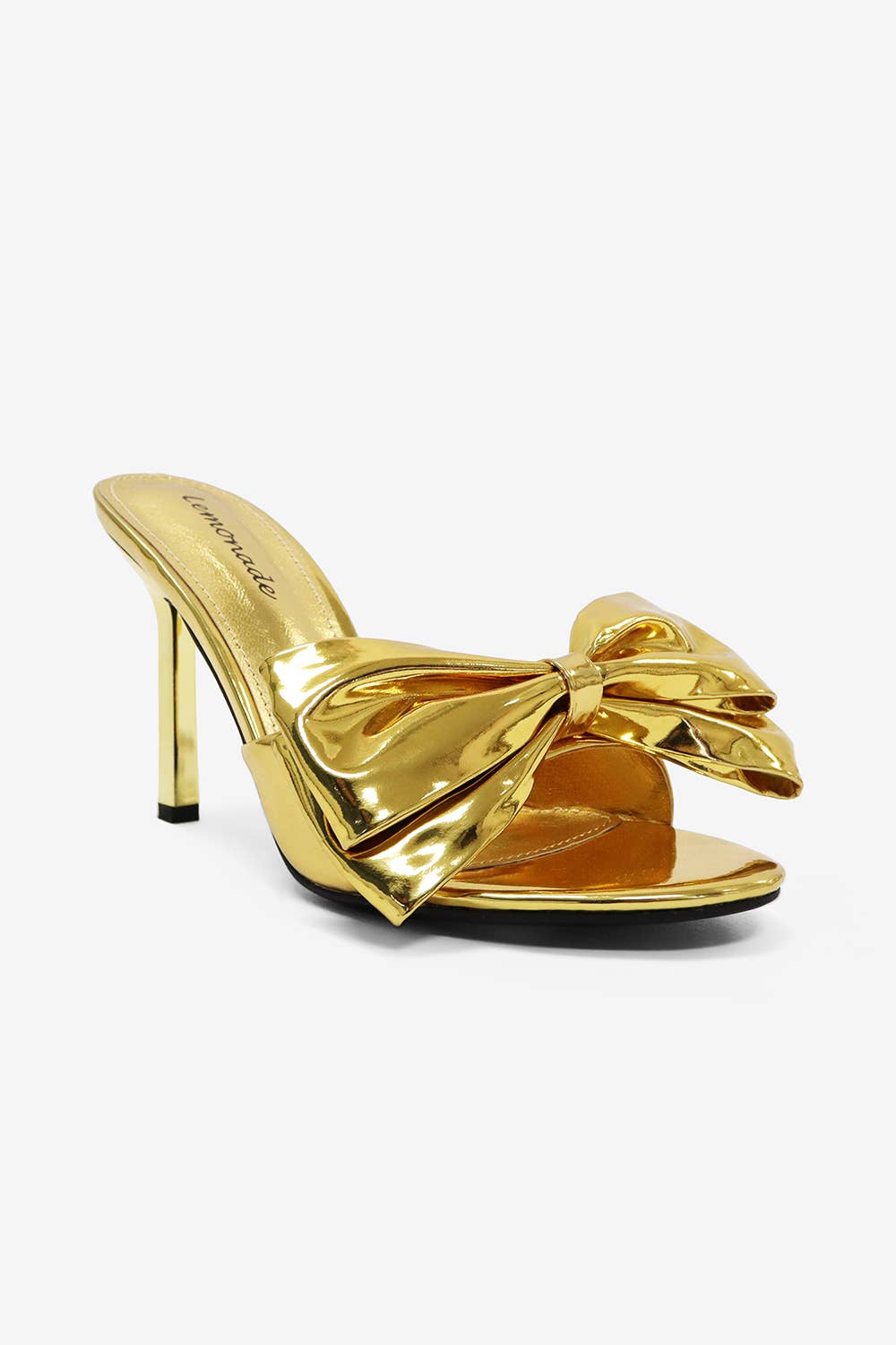 a gold shoe with a bow on the heel