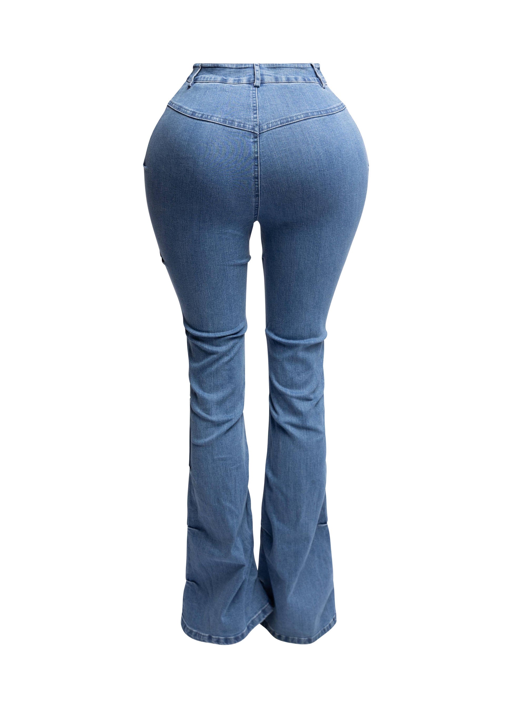 a woman in high rise jeans is standing up