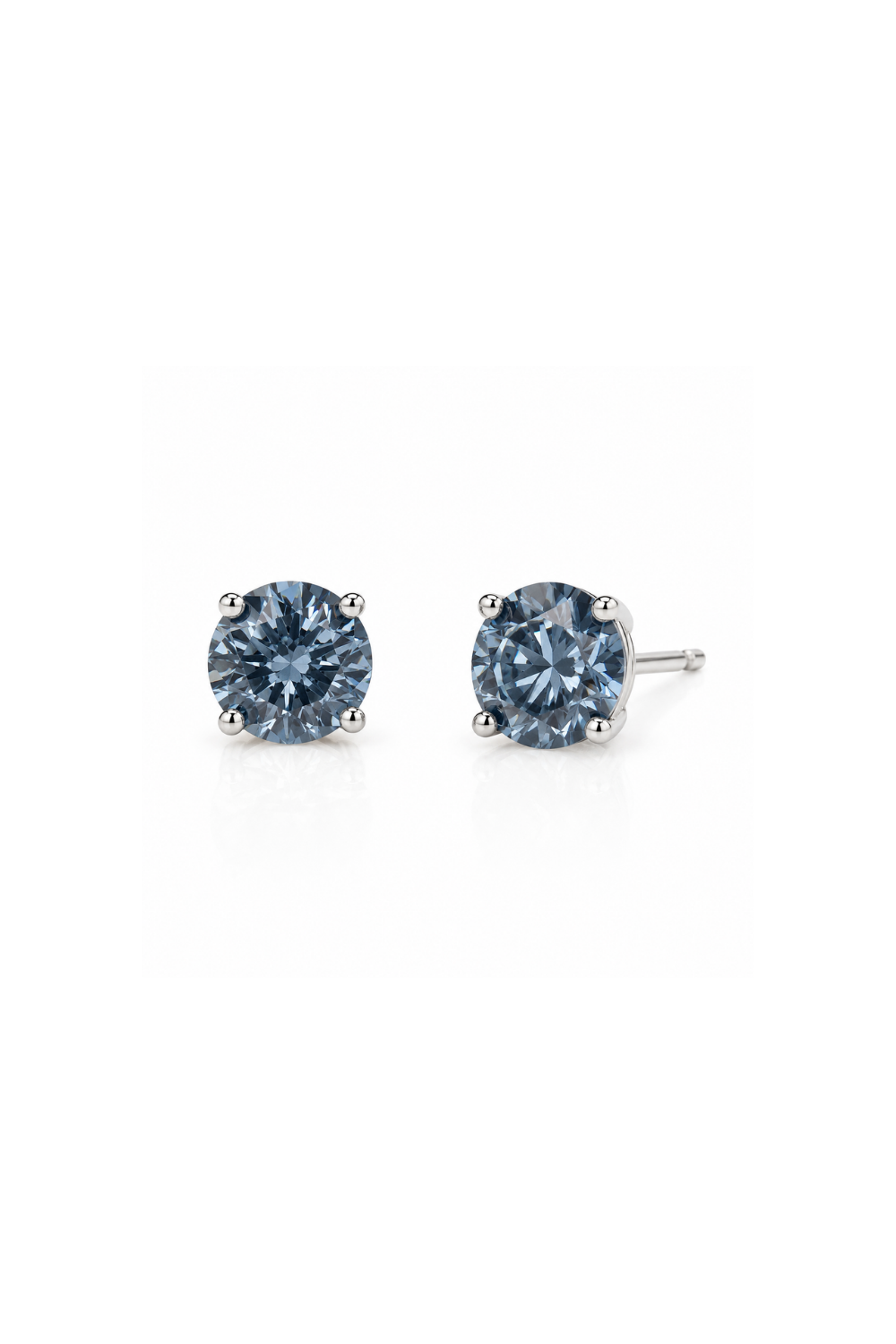 A pair of round-cut stud earrings featuring light blue gemstones in a four-prong setting with silver-toned posts, shown on a plain white background.